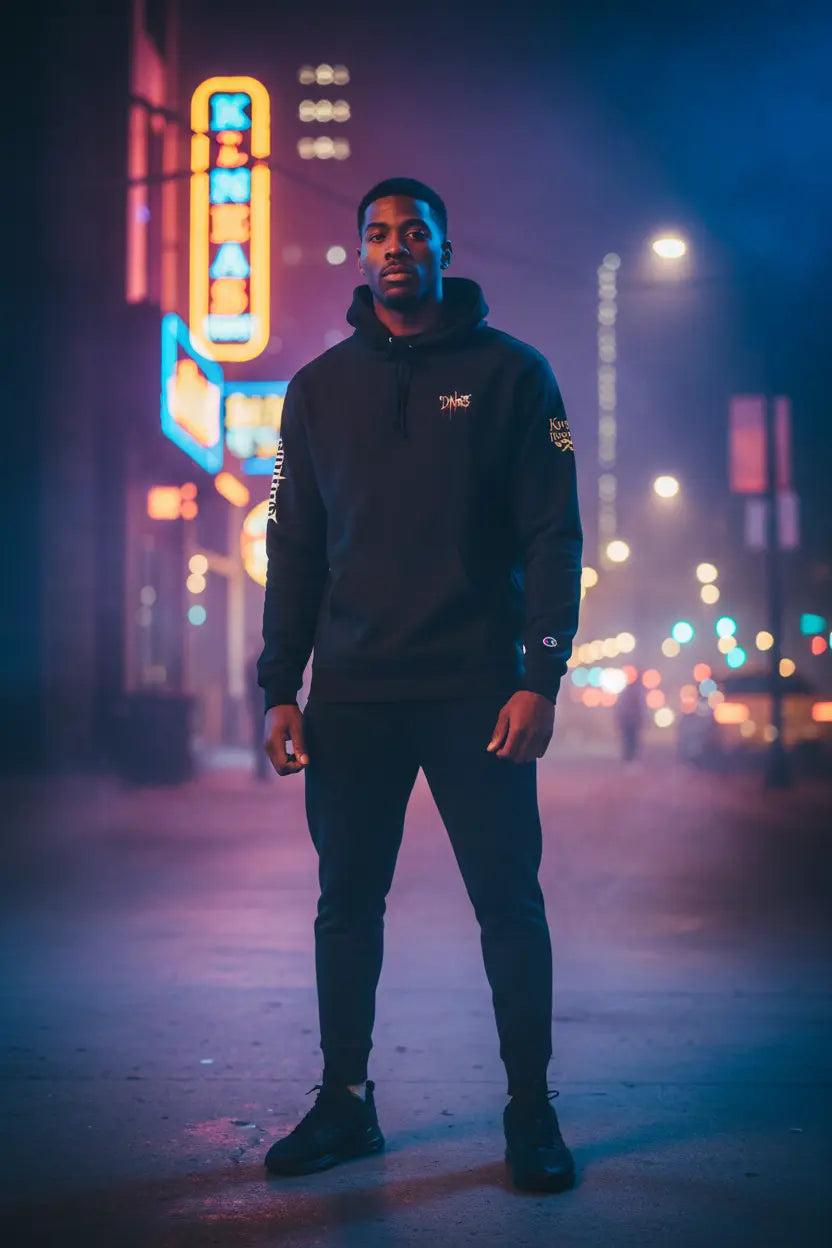 D. Nas Special Edition Champion® Hoodie - Premium nighttime urban setting with neon lighting and city bokeh